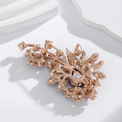 Broche bloem donker rood antreciet